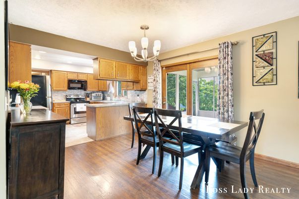 Chandelier, Dining room, Interior, Kitchen, Pendant Lights, Stainless Steel Appliances, Wood Texture Flooring