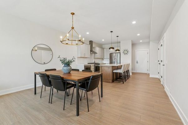 Chandelier, Dining room, Interior, Kitchen, Pendant Lights, Recessed Lighting, Stainless Steel Appliances, Wood Texture Flooring