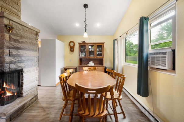Dining room, Fireplace, Interior, Pendant Lights, Recessed Lighting, Stone Walls, Wood Texture Flooring