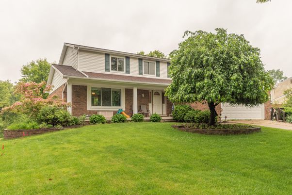 Attached, Backyard, Exterior, Facade, Brick Facade, American Foursquare