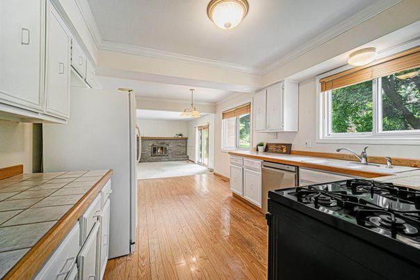 Interior, Kitchen, Pendant Lights, Tile Countertops, Wood Texture Flooring