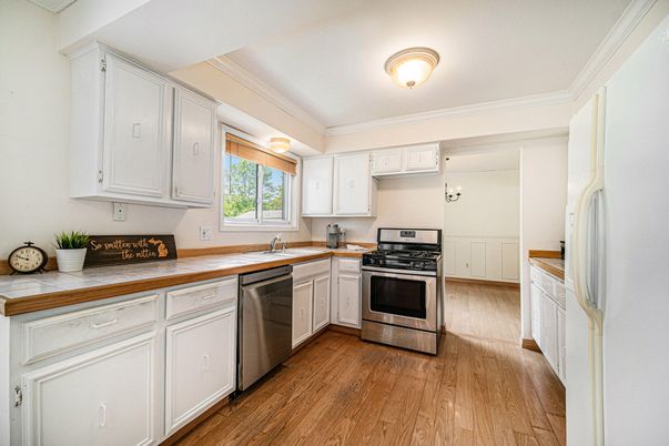 Interior, Kitchen, Stainless Steel Appliances, Tile Countertops, Wood Texture Flooring