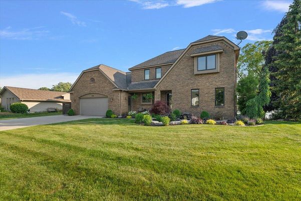 Attached, Backyard, Exterior, Facade, Brick Facade, Brick Traditional