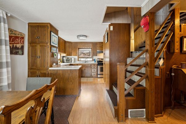 Interior, Kitchen, Stainless Steel Appliances, Wood Texture Flooring, Wooden Walls