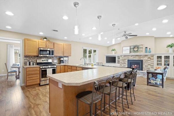 Fireplace, Interior, Kitchen, Pendant Lights, Recessed Lighting, Stainless Steel Appliances, Wood Texture Flooring