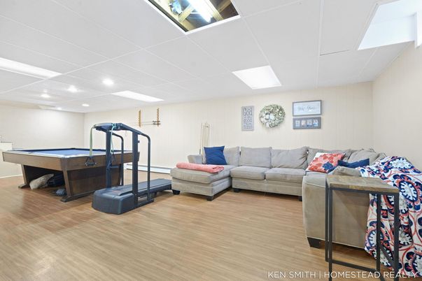 Billiard Table, Fitness Equipment, Game Room, Interior, Living room, Recessed Lighting, Wood Texture Flooring