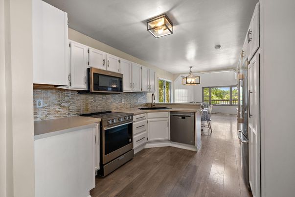 Dining room, Interior, Kitchen, Pendant Lights, Stainless Steel Appliances, Wood Texture Flooring