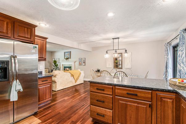 Dining room, Fireplace, Interior, Kitchen, Living room, Pendant Lights, Recessed Lighting, Stainless Steel Appliances, Wood Texture Flooring