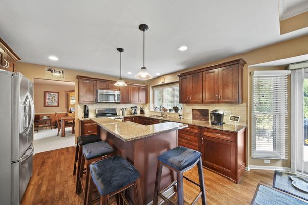 Dining room, Interior, Kitchen, Pendant Lights, Recessed Lighting, Stainless Steel Appliances, Wood Texture Flooring