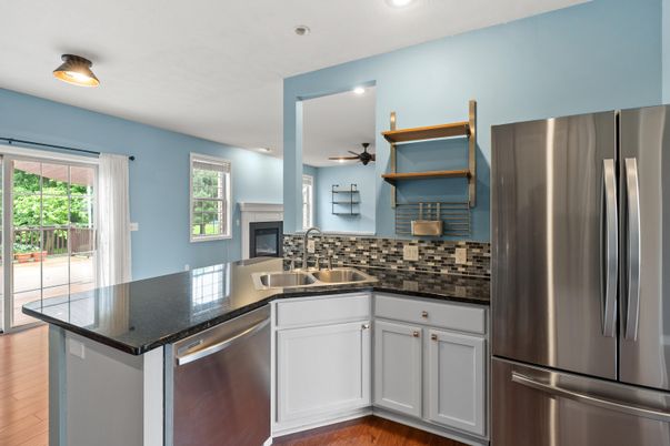 Fireplace, Interior, Kitchen, Recessed Lighting, Stainless Steel Appliances, Wood Texture Flooring