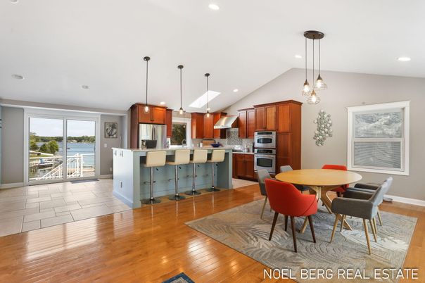 Dining room, Interior, Kitchen, Pendant Lights, Recessed Lighting, Stainless Steel Appliances, Water, Wood Texture Flooring