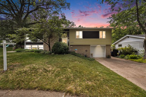 Attached, Backyard, Exterior, Facade, Brick Facade, Raised Ranch