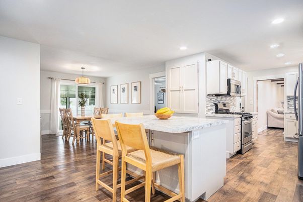 Dining room, Interior, Kitchen, Pendant Lights, Recessed Lighting, Stainless Steel Appliances, Wood Texture Flooring