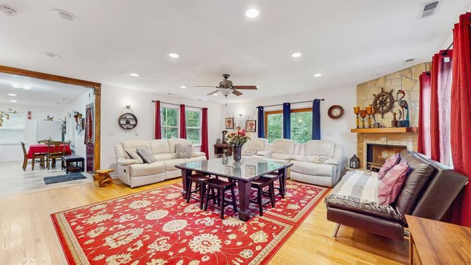 Dining room, Fireplace, Interior, Living room, Recessed Lighting, Wood Texture Flooring