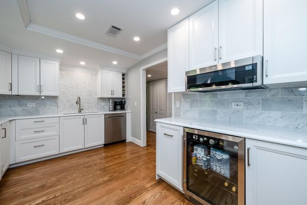 Interior, Kitchen, Marble Walls, Recessed Lighting, Stainless Steel Appliances, Wood Texture Flooring