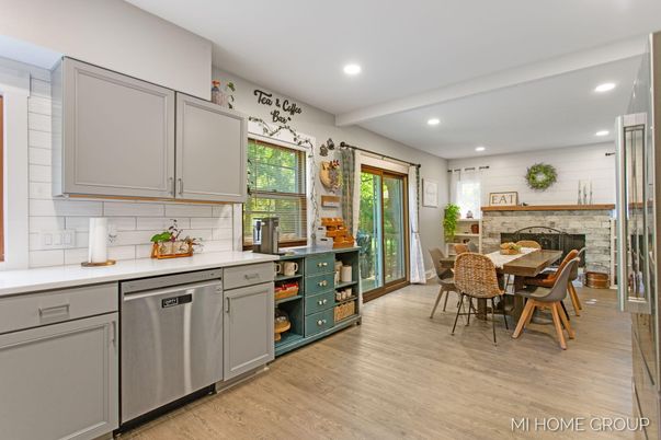 Dining room, Fireplace, Interior, Kitchen, Recessed Lighting, Stainless Steel Appliances, Wood Texture Flooring
