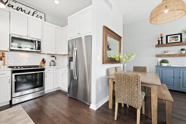 Dining room, Interior, Kitchen, Pendant Lights, Recessed Lighting, Stainless Steel Appliances, Wood Texture Flooring