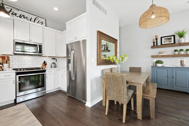 Dining room, Interior, Kitchen, Pendant Lights, Recessed Lighting, Stainless Steel Appliances, Wood Texture Flooring
