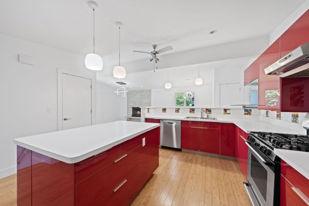 Fireplace, Interior, Kitchen, Pendant Lights, Recessed Lighting, Stainless Steel Appliances, Stone Walls, Wood Texture Flooring