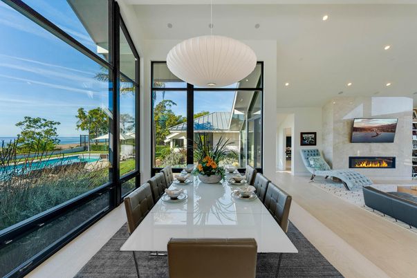 Dining room, Fireplace, Interior, Pendant Lights, Recessed Lighting, Water, Wood Texture Flooring