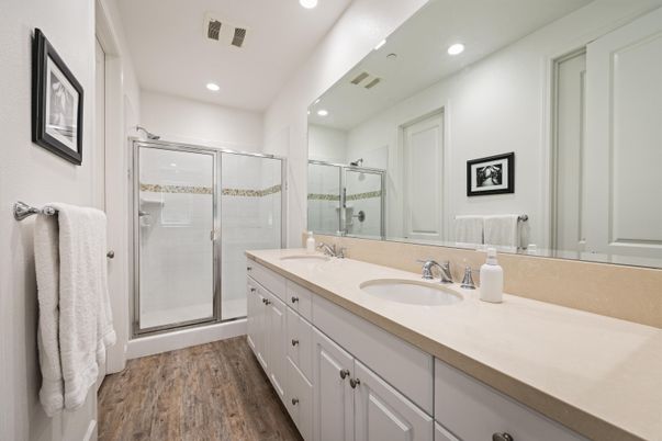 Bathroom, Dual Sink Vanities, Glass Shower, Interior, Recessed Lighting, Wood Texture Flooring