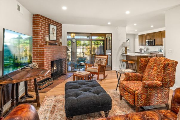Fireplace, Interior, Kitchen, Living room, Recessed Lighting, Stainless Steel Appliances, Stone Walls, Wood Texture Flooring