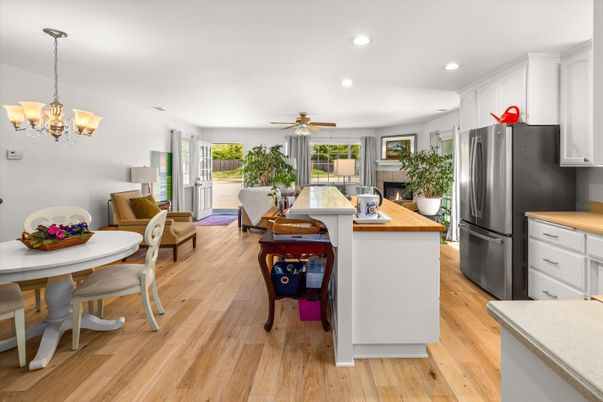 Chandelier, Dining room, Interior, Kitchen, Living room, Recessed Lighting, Stainless Steel Appliances, Wood Texture Flooring
