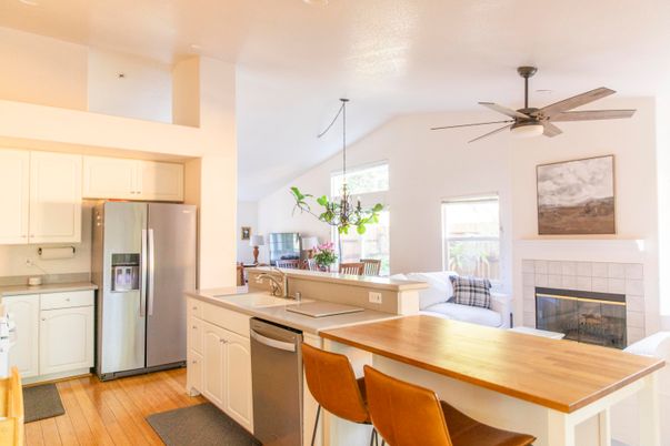 Fireplace, Interior, Kitchen, Stainless Steel Appliances, Wood Texture Flooring