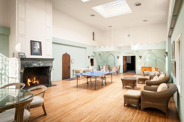 Fireplace, Game Room, Interior, Living room, Pendant Lights, Recessed Lighting, Wood Texture Flooring