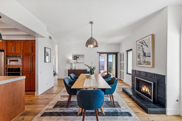 Dining room, Fireplace, Interior, Kitchen, Pendant Lights, Stainless Steel Appliances, Wood Texture Flooring