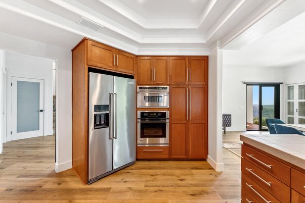 Interior, Kitchen, Recessed Lighting, Stainless Steel Appliances, Tile Countertops, Wood Texture Flooring
