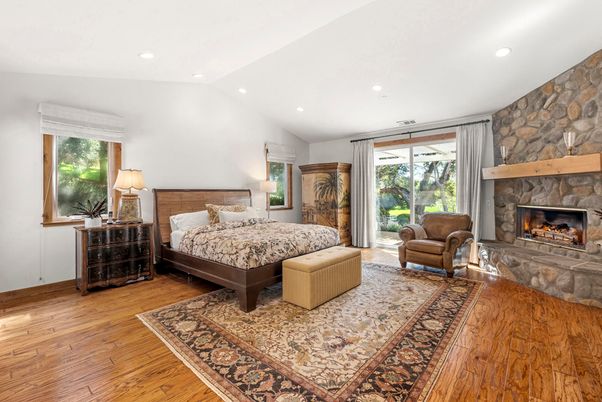 Bedroom, Fireplace, Interior, Recessed Lighting, Stone Walls, Wood Texture Flooring
