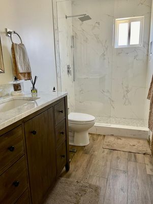 Bathroom, Glass Shower, Interior, Marble Walls, Wood Texture Flooring