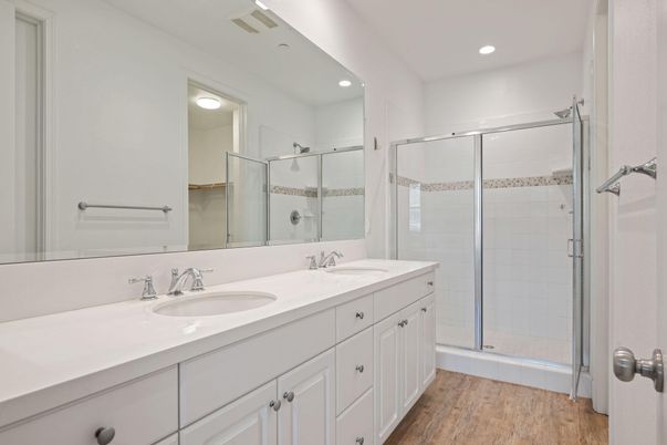 Bathroom, Dual Sink Vanities, Glass Shower, Interior, Recessed Lighting, Wood Texture Flooring