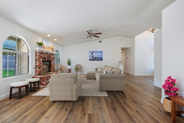 Fireplace, Interior, Living room, Recessed Lighting, Stone Walls, Wood Texture Flooring