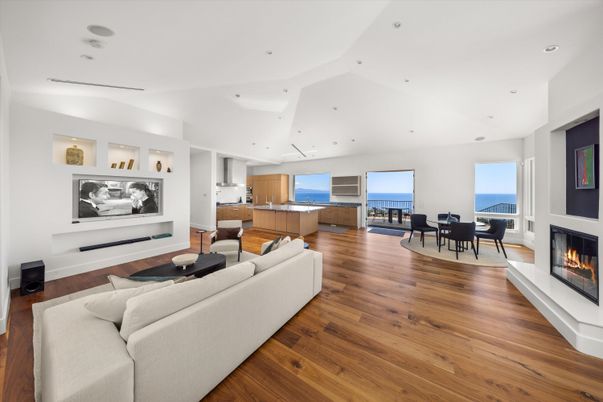 Dining room, Fireplace, Interior, Living room, Recessed Lighting, Water, Wood Texture Flooring