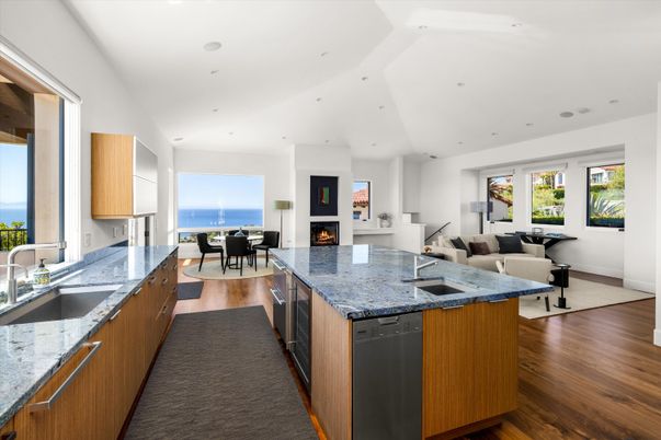 Dining room, Fireplace, Interior, Kitchen, Living room, Recessed Lighting, Water, Wood Texture Flooring