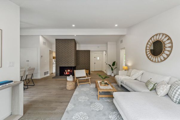 Fireplace, Interior, Living room, Recessed Lighting, Stone Walls, Wood Texture Flooring