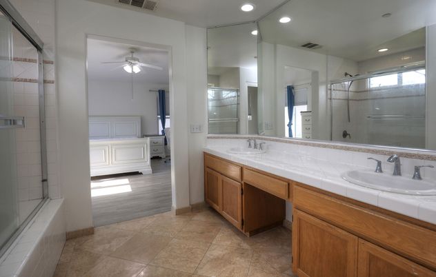 Bathroom, Dual Sink Vanities, Glass Shower, Interior, Recessed Lighting, Tile Countertops