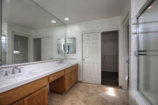 Bathroom, Dual Sink Vanities, Glass Shower, Interior, Recessed Lighting, Tile Countertops