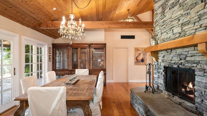 Chandelier, Dining room, Fireplace, Interior, Recessed Lighting, Stone Walls, Wooden Beams, Wooden Ceilings, Wood Texture Flooring