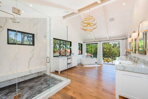 Bathroom, Free Standing Baths, Glass Shower, Interior, Marble Walls, Pendant Lights, Recessed Lighting, Wood Texture Flooring