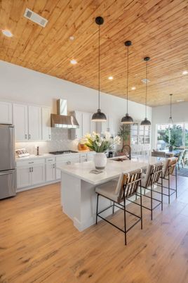 Dining room, Interior, Kitchen, Pendant Lights, Recessed Lighting, Stainless Steel Appliances, Wooden Ceilings, Wood Texture Flooring