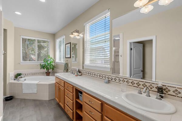 Bathroom, Dual Sink Vanities, Interior, Recessed Lighting, Tile Countertops, Wood Texture Flooring