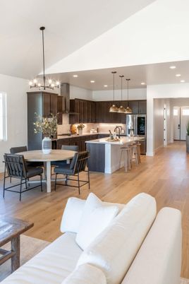 Chandelier, Dining room, Interior, Kitchen, Living room, Pendant Lights, Recessed Lighting, Stainless Steel Appliances, Wood Texture Flooring
