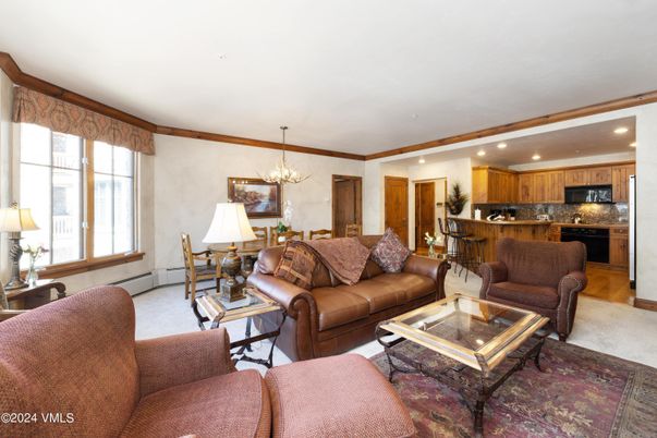 Chandelier, Dining room, Interior, Kitchen, Living room, Recessed Lighting, Stainless Steel Appliances, Wood Texture Flooring