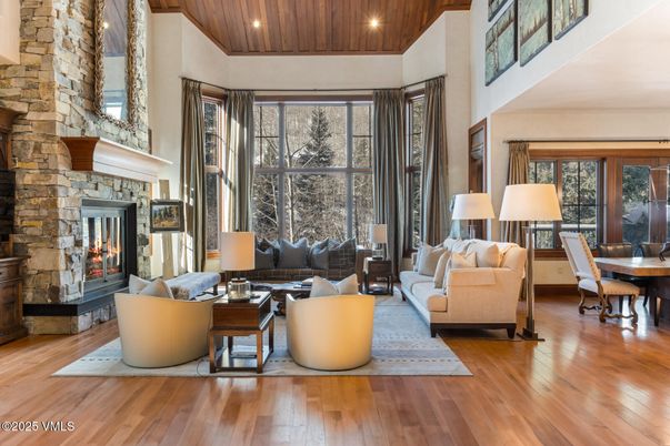 Dining room, Fireplace, Interior, Living room, Recessed Lighting, Stone Walls, Wooden Ceilings, Wood Texture Flooring