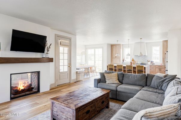 Dining room, Fireplace, Interior, Kitchen, Living room, Pendant Lights, Wood Texture Flooring