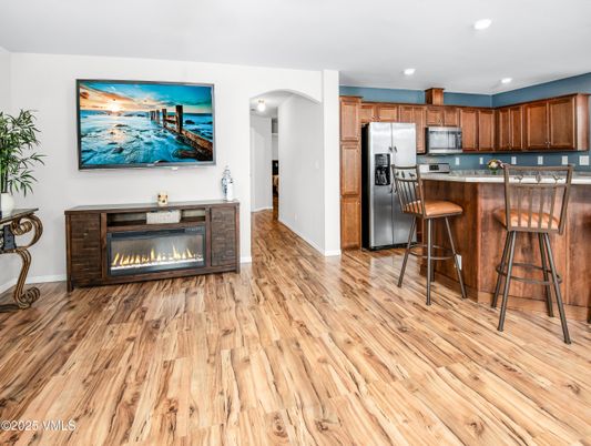 Fireplace, Interior, Kitchen, Recessed Lighting, Stainless Steel Appliances, Wood Texture Flooring