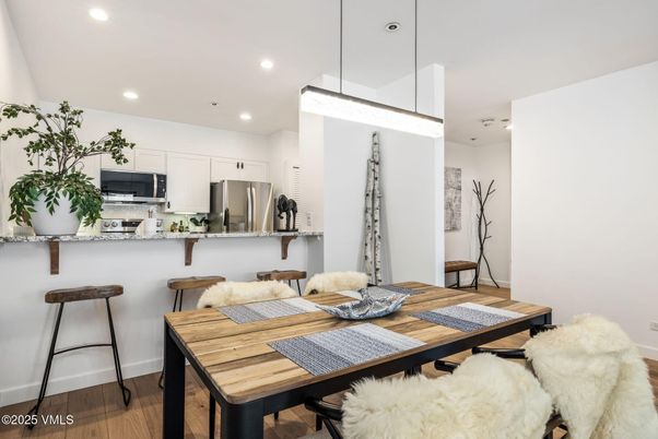 Dining room, Interior, Kitchen, Pendant Lights, Recessed Lighting, Stainless Steel Appliances, Wood Texture Flooring